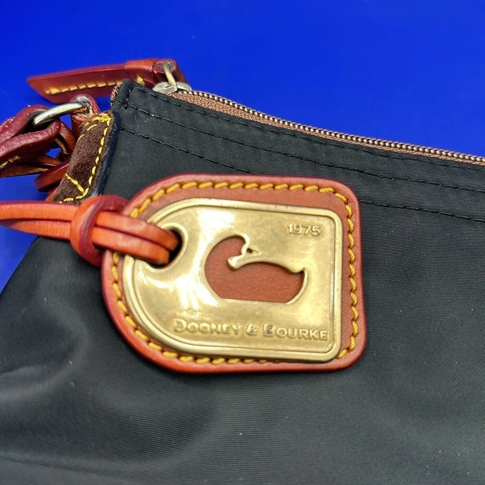 Dooney & Bourke Blue Nylon Crossbody Pouchette. Leather Strap & DB Tag